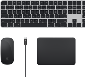 Draufsicht auf Mac Zubehör: Magic Keyboard, Magic Mouse, Magic Trackpad und Thunderbolt Kabel.